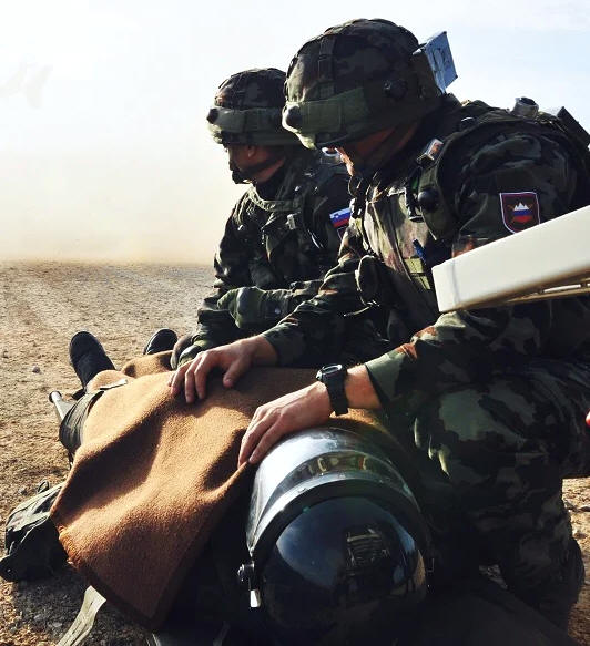 Medevac medic tends soldier.